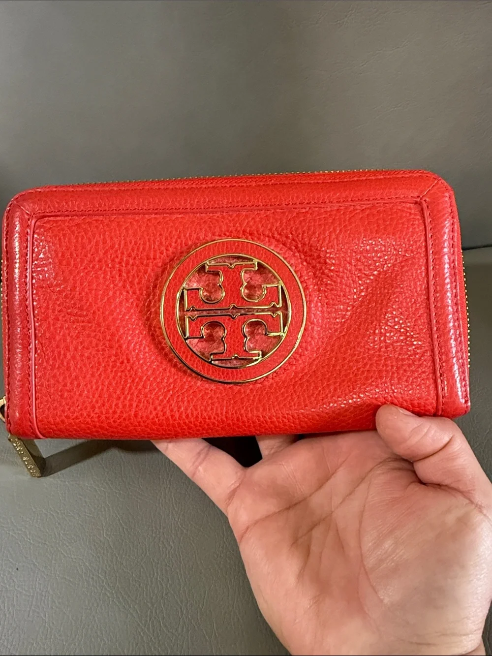 Tory Burch orange Pebbled Leather Zip Wallet with Gold Logo